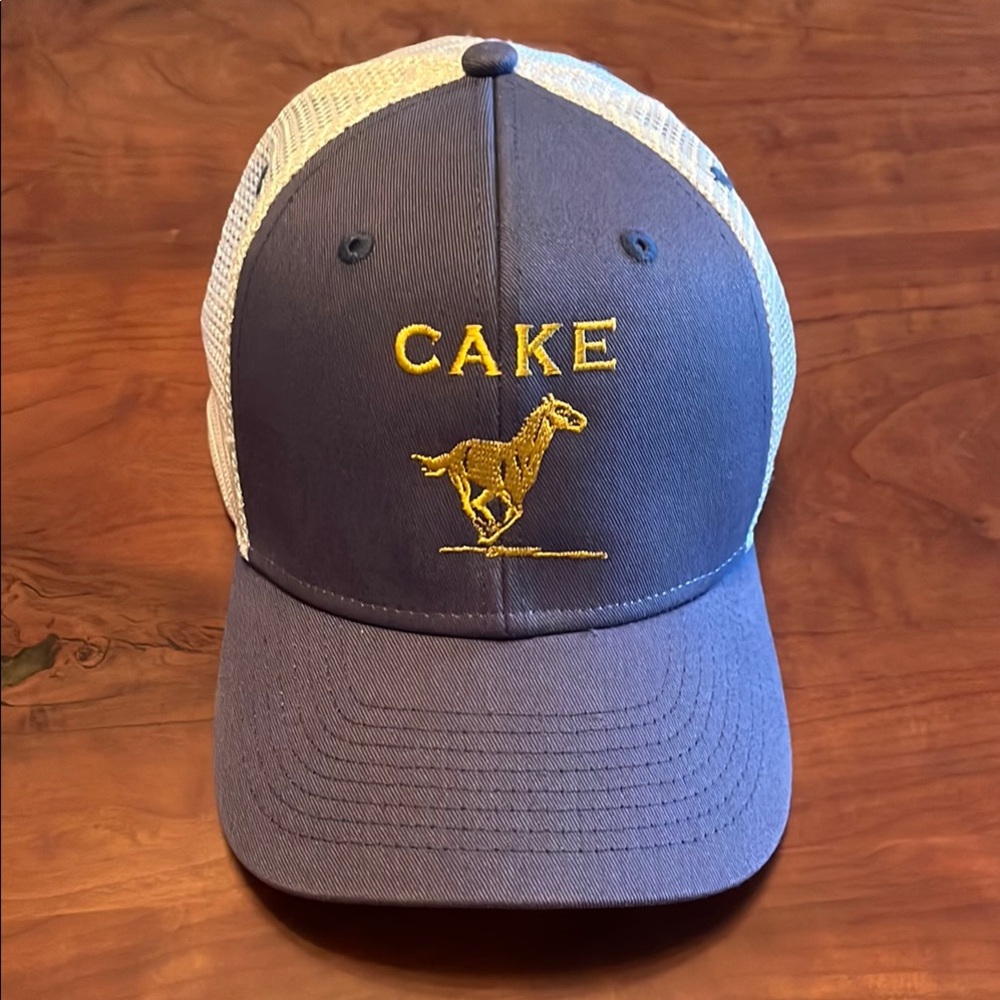 Blue and White Trucker Hat with Yellow Embroidery CAKE official band merch 2024